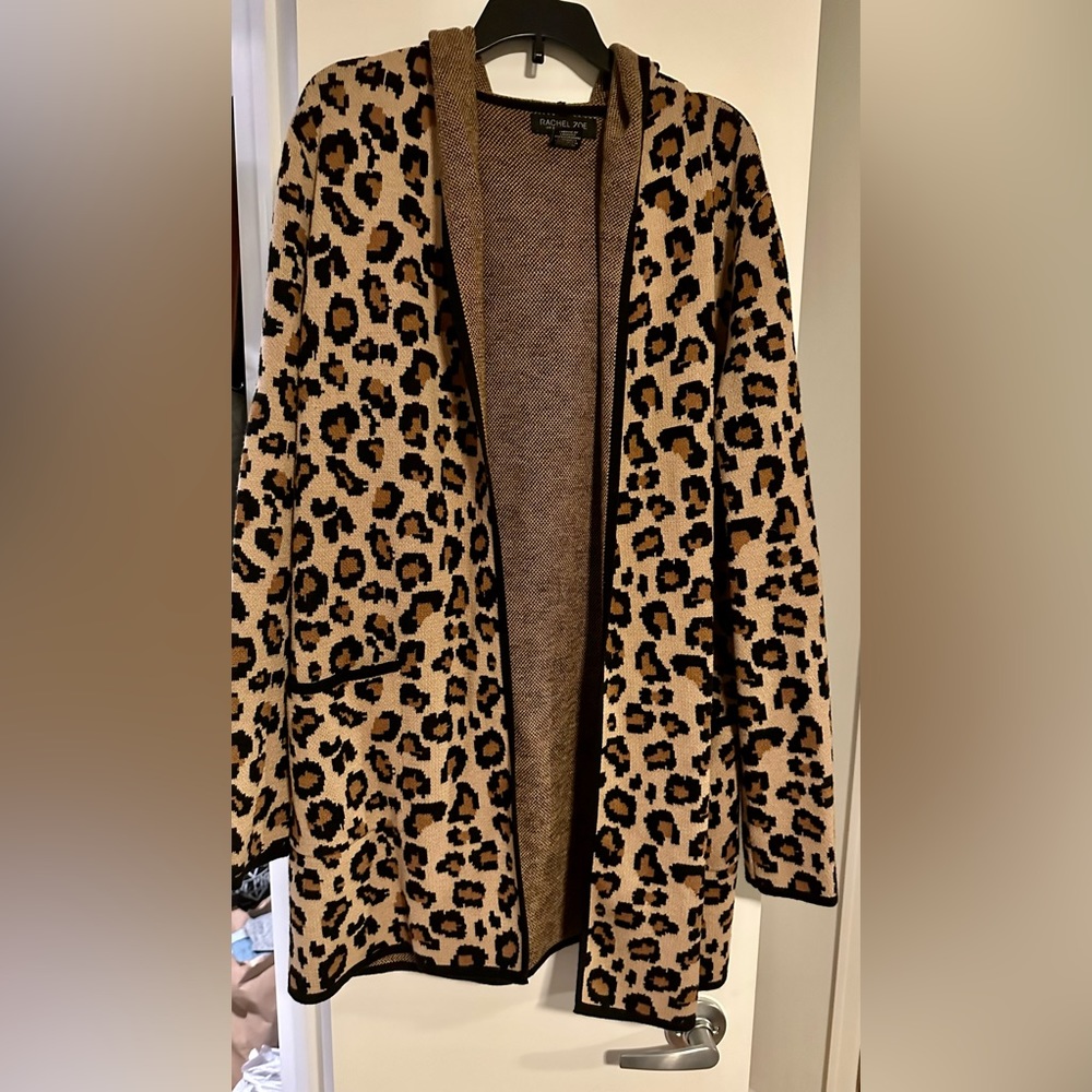 Leopard print cardigan with open front and hood.